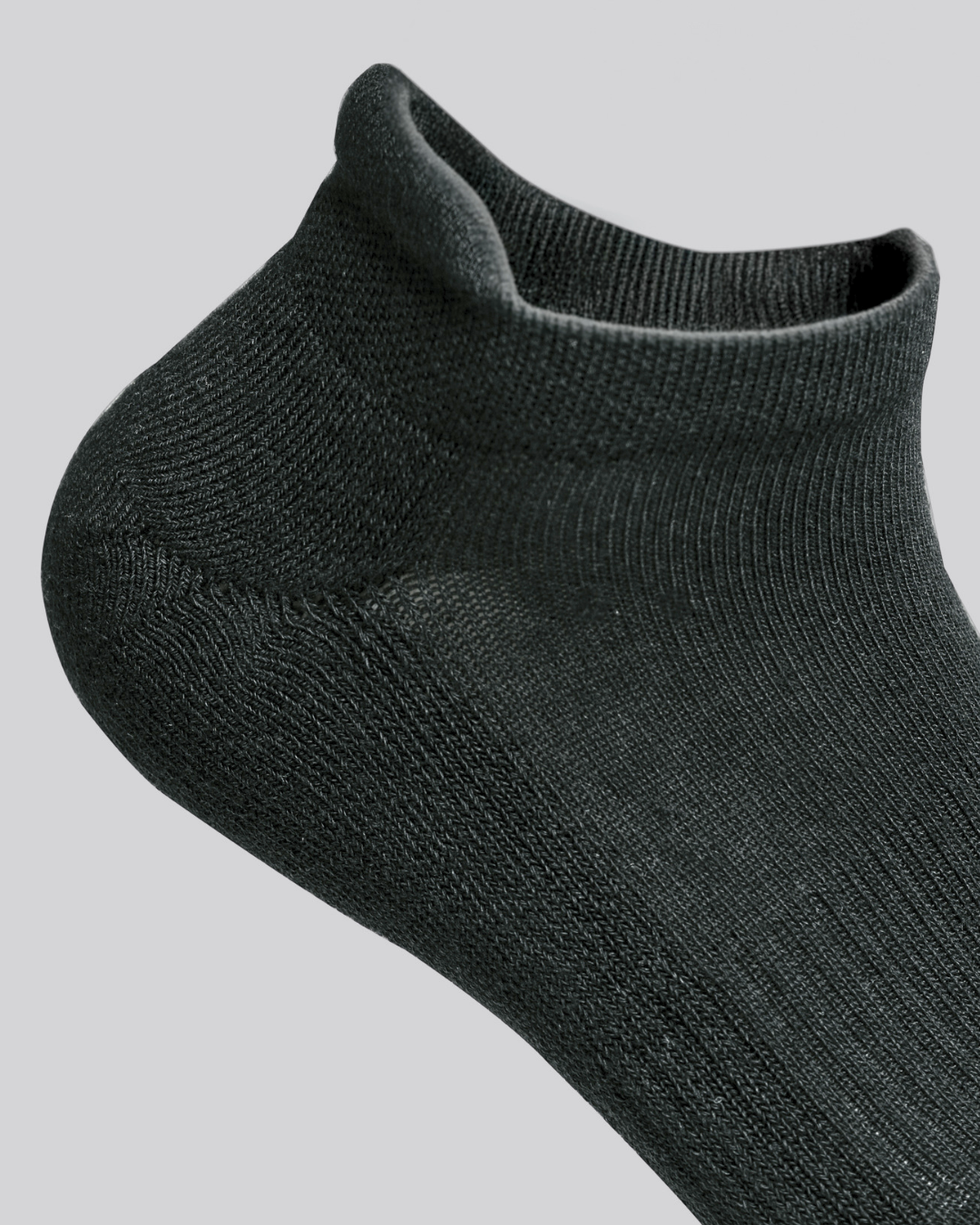 Close up DryStep unisex black ankle tab socks — moisture-wicking training sock with heel tab
