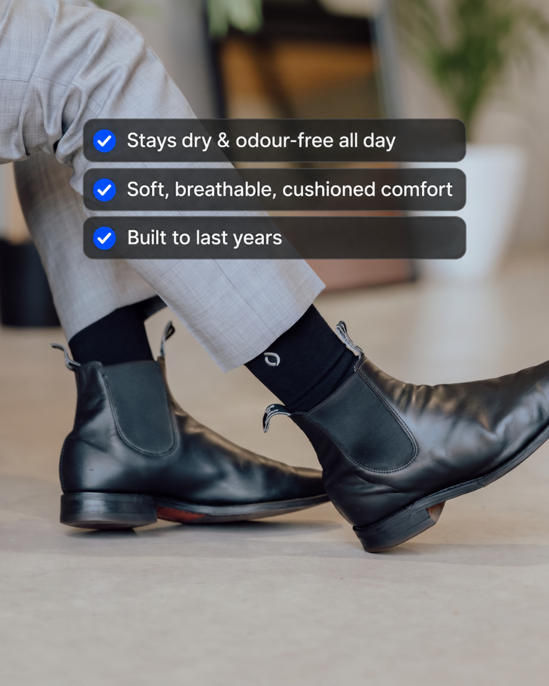 Man wearing DryStep black crew socks in RM Williams boots — sweat-proof dress socks