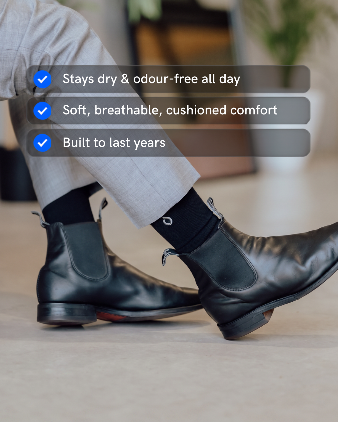 Man wearing DryStep black crew socks in RM Williams boots — sweat-proof dress socks
