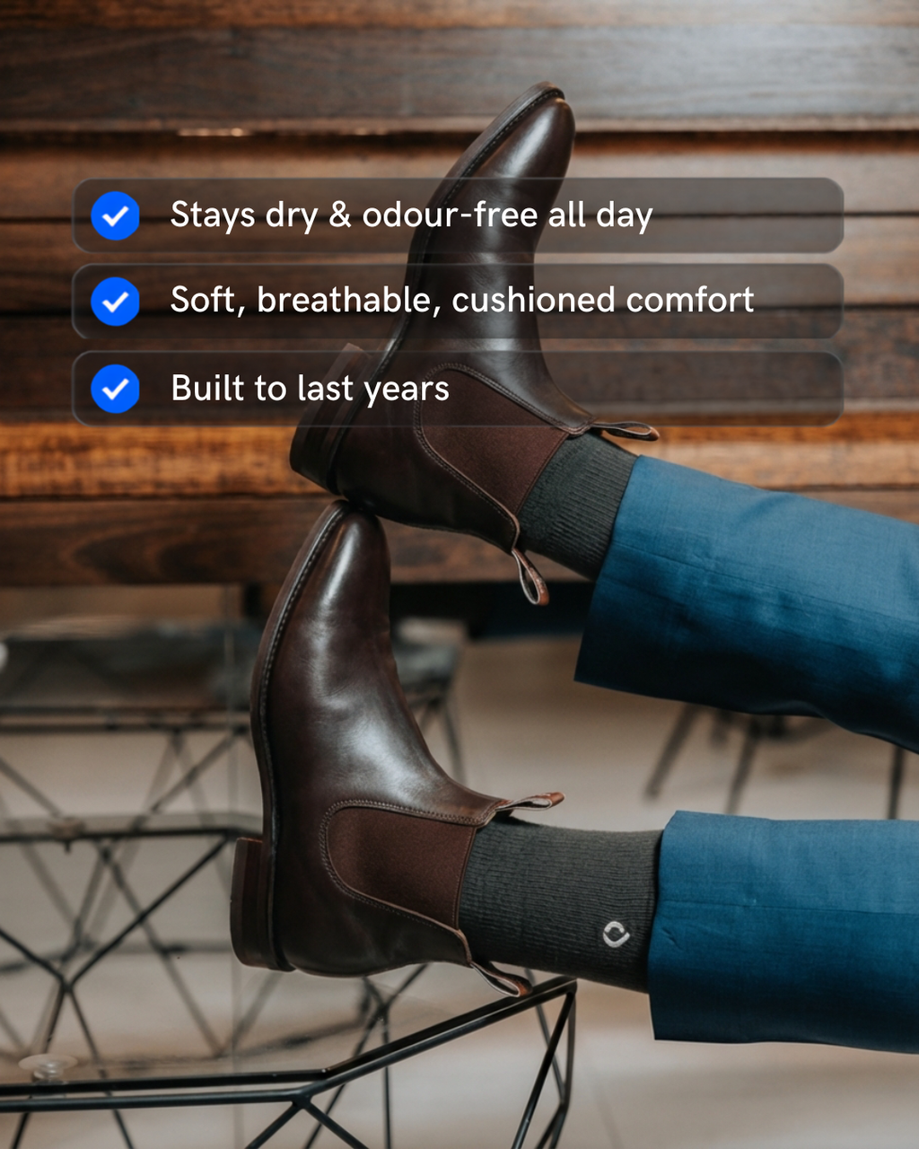Man wearing DryStep dark grey crew socks at office — sweat-proof mens dress sock