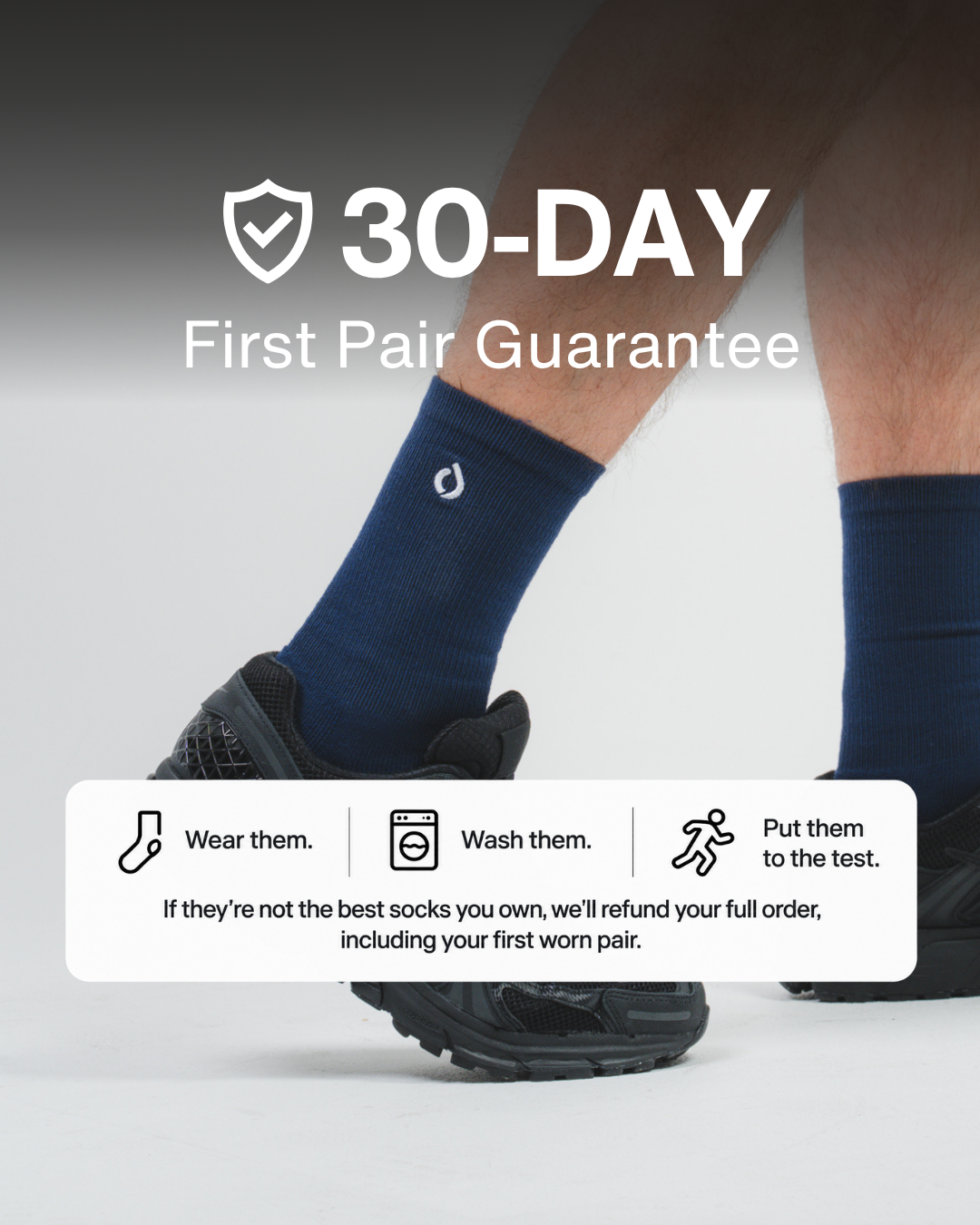 Man in midnight navy crew socks and black trainers, 30-day first pair guarantee