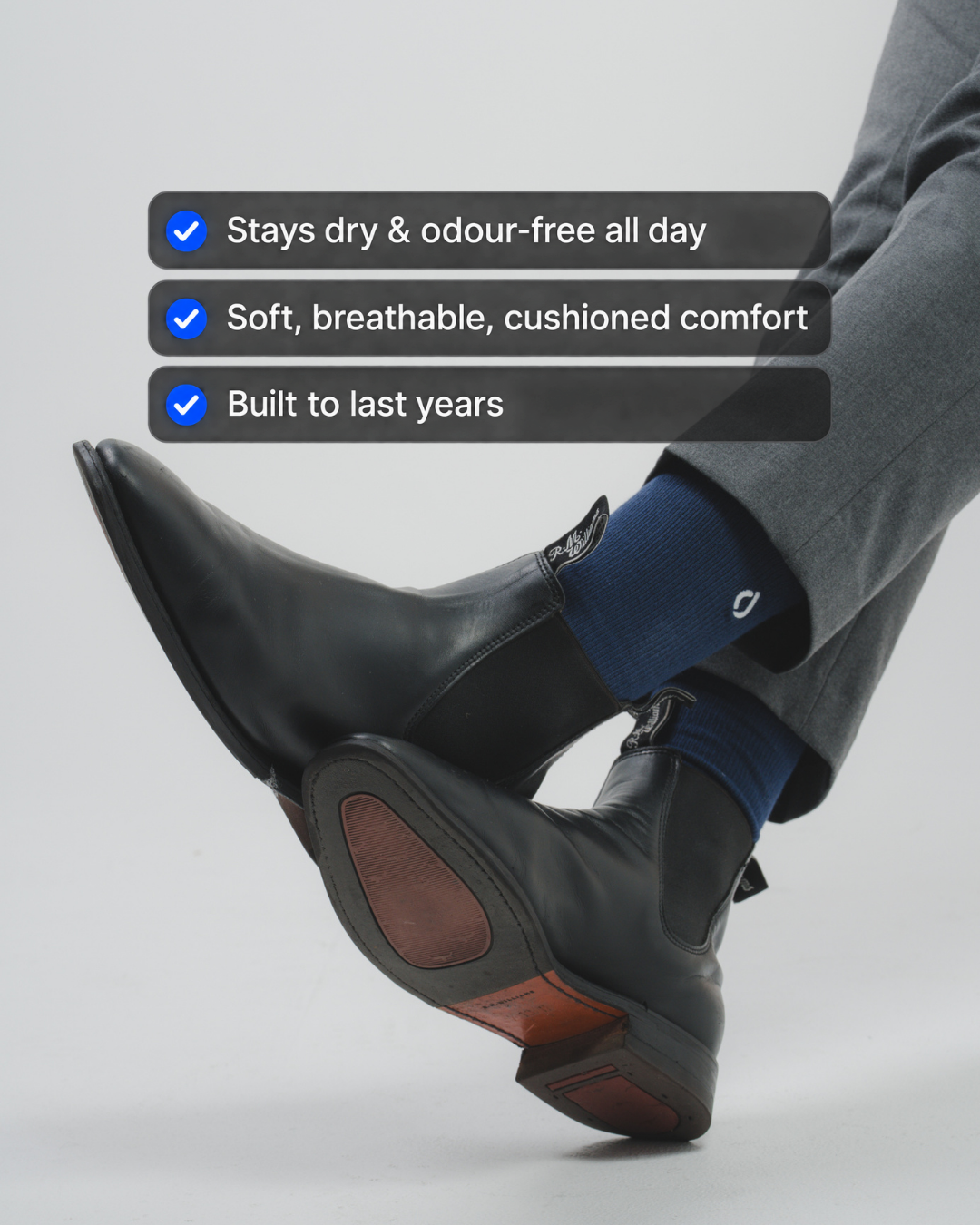 Man wearing DryStep midnight navy crew socks at office — performance dress socks with suit