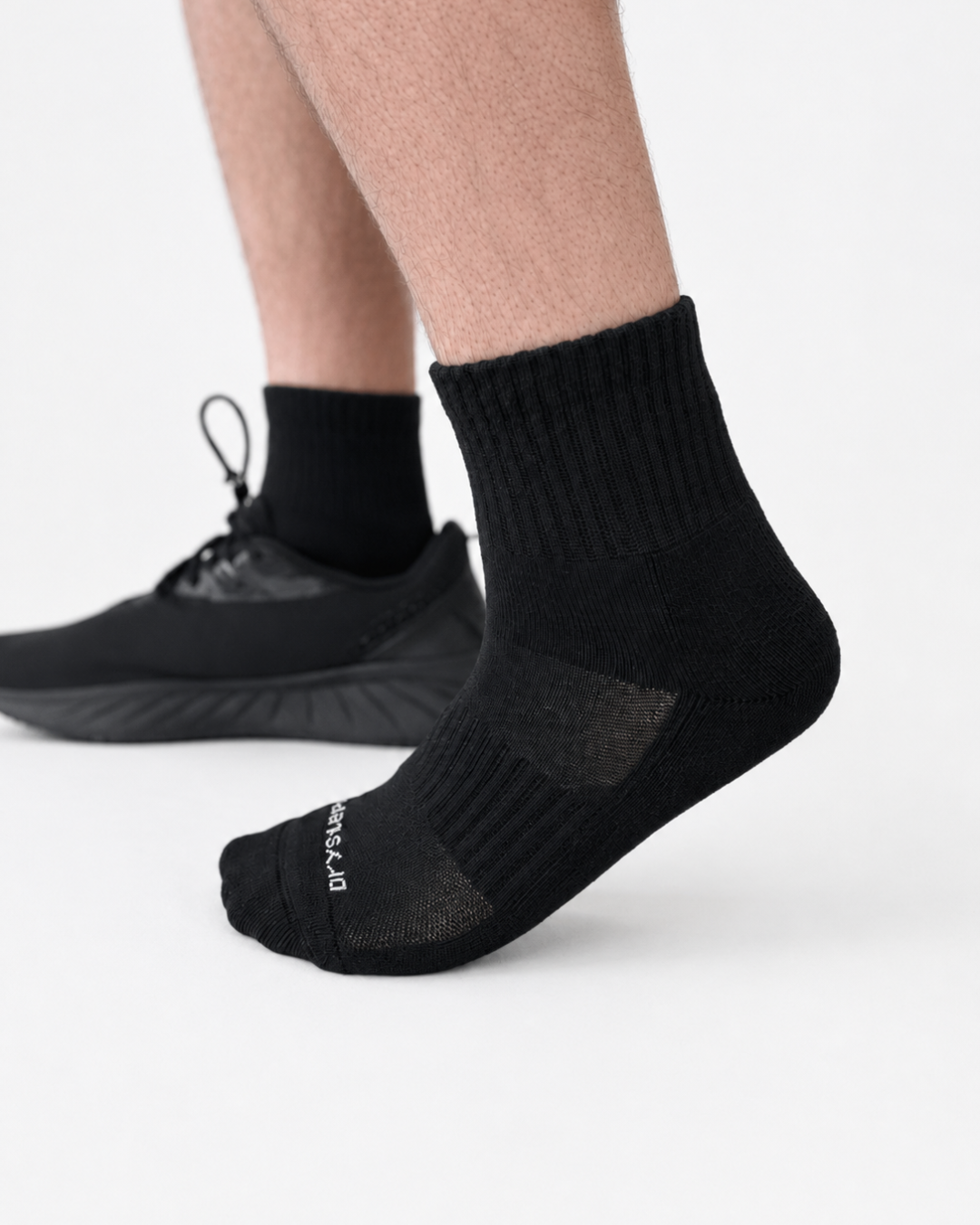 DryStep black quarter-length athletic socks, studio product photo