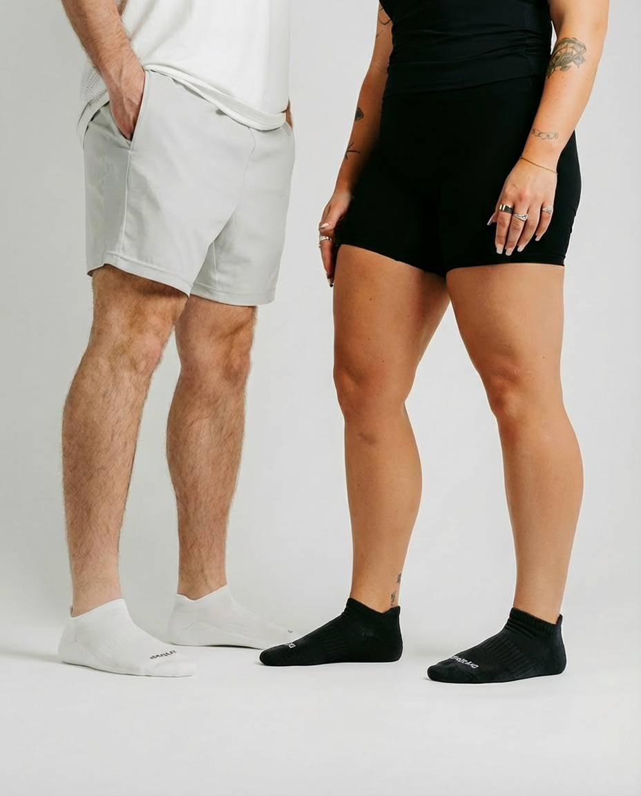 DryStep white and black ankle tab socks on foot — versatile office to gym performance sock
